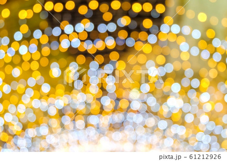 Orange, yellow and white bokeh light at Festival. Abstract or blurred of light glitter. Glow texture background. 61212926