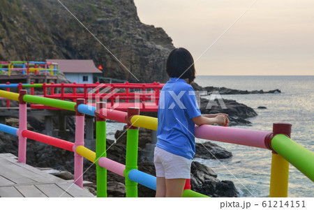 An Asian woman enjoying the sea An Asian woman enjoying the sea 61214151