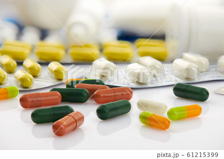 Various tablets, pills and vitamins in blister 61215399