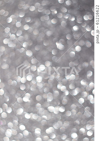 Silver defocused glitter backround. Silver defocused glitter backround. 61216622