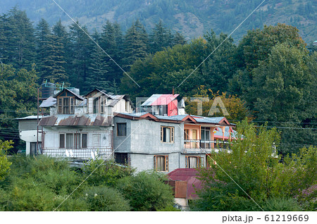 Panoramic Old Hotel cottage retro style building surrounded with pine woodland trees 61219669