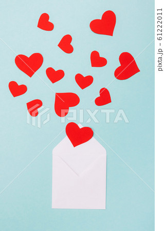 Red hearts in an open white envelope Red hearts in an open white envelope 61222011