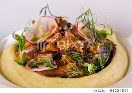 Fried fox mushrooms with greens and radish, served with puree potatoes 61224615