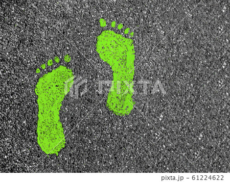 Green footprints on asphalt Green footprints on asphalt 61224622