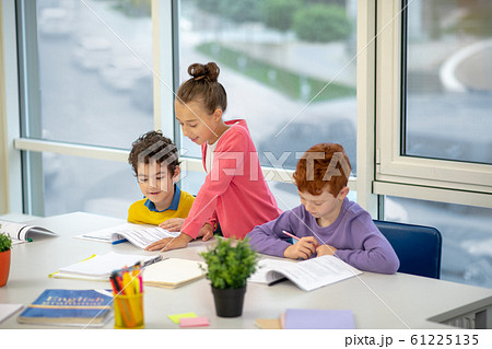 kids helping each other with the home task kids helping each other with the home task 61225135