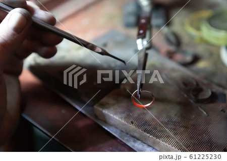 Work of the master, jeweler. Jewelry repair shop. Manufacturing of jewelry. 61225230