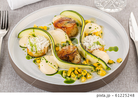 Sea scallops with zucchini and canned corn, with sauce and souffle 61225248