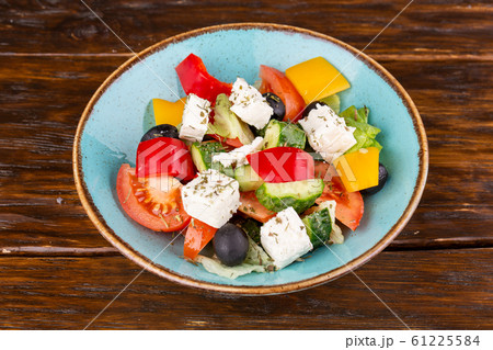 Greek salad, with cheese and fresh vegetables with seasonings 61225584