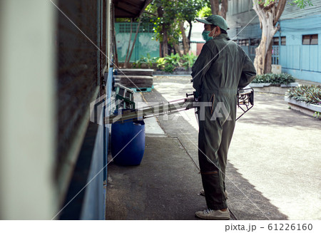 Man work fogging to eliminate mosquito for preventing spread dengue fever Man work fogging to eliminate mosquito for preventing spread dengue fever 61226160