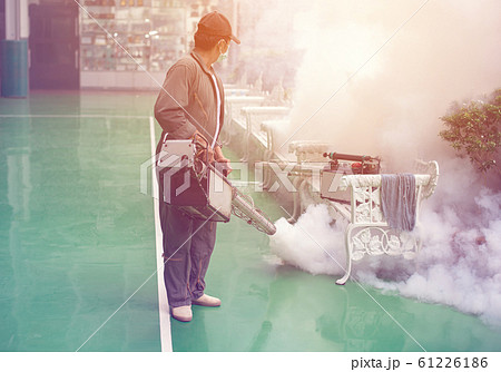 Man work fogging to eliminate mosquito for preventing spread dengue fever Man work fogging to eliminate mosquito for preventing spread dengue fever 61226186