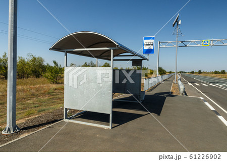 empty bus stop on the road 61226902