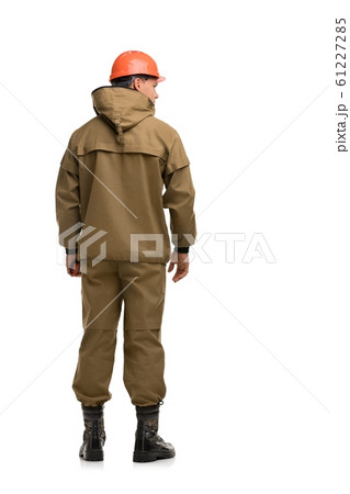 Man in khaki work clothes rearview 61227285