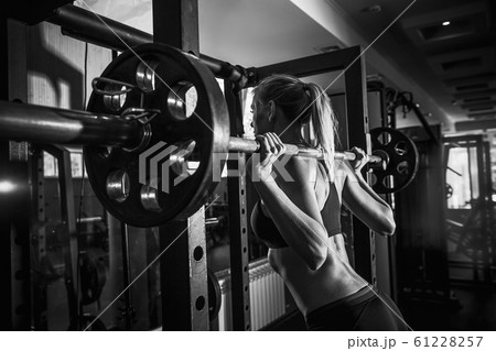 Young sexy blonde girl in the gym preparing to do exercise 61228257