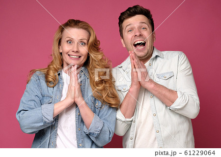 Caucasian people man and woman expressing their excitement and delight Caucasian people man and woman expressing their excitement and delight 61229064