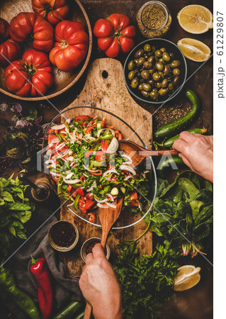 Womans hands cooking Turkish Chopard Salad with Womans hands cooking Turkish Chopard Salad with 61229807