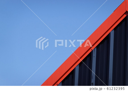 Black and red metal steel plate for background. Blue sky background. 61232395