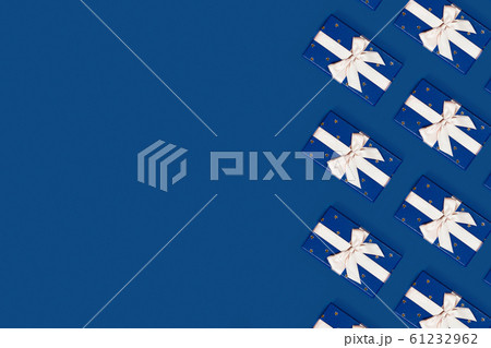 Blue gift boxes on a blue background. 61232962