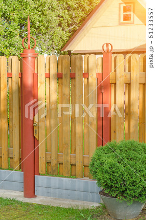 brick and mettal fence 61233557