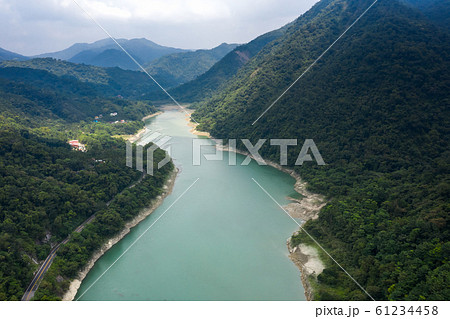 road with trees near the lake in Mingtan Reservoir road with trees near the lake in Mingtan Reservoir 61234458