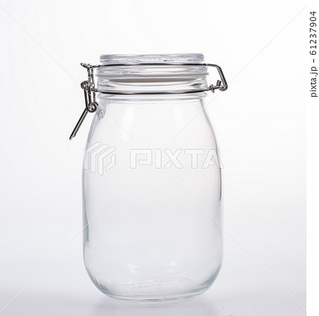 Glass jar with lid on white background Glass jar with lid on white background 61237904