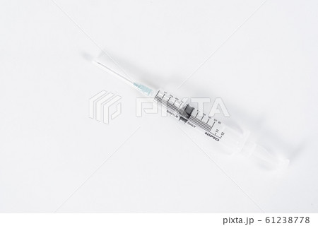 Empty medical syringe (needle) on white background 61238778