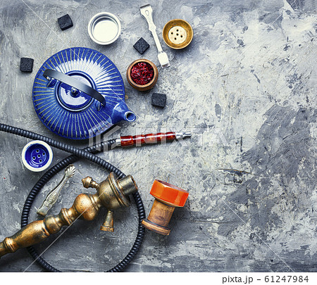 Turkish smoking hookah and tea. Turkish smoking hookah and tea. 61247984