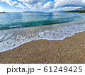 Pebble beach and wave foam 61249425