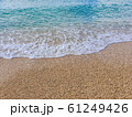 Pebble beach and wave foam 61249426