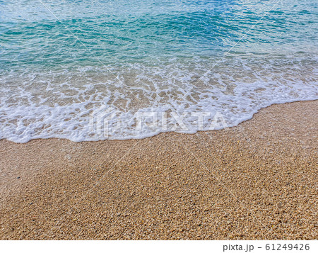 Pebble beach and wave foam 61249426
