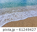 Pebble beach and wave foam 61249427