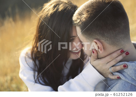 Romantic couple dressed in cozy sweaters together Romantic couple dressed in cozy sweaters together 61252126