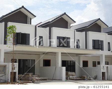 Double story luxury terrace house under construction in Malaysia.  Designed by an architect with a modern and contemporary style.  61255141