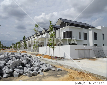Double story luxury terrace house under construction in Malaysia.  Designed by an architect with a modern and contemporary style.  61255143
