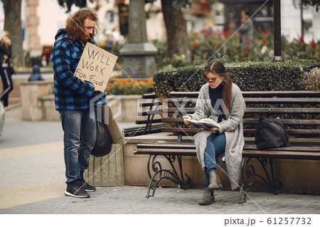 Homeless man in a durty clothes autumn city Homeless man in a durty clothes autumn city 61257732