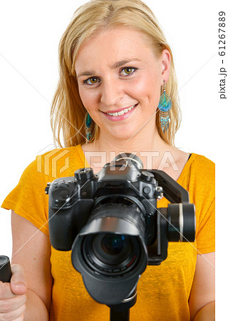 woman videographer using steady cam, on white woman videographer using steady cam, on white 61267889