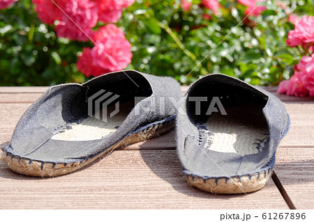 pair of slippers on the garden terrace 61267896