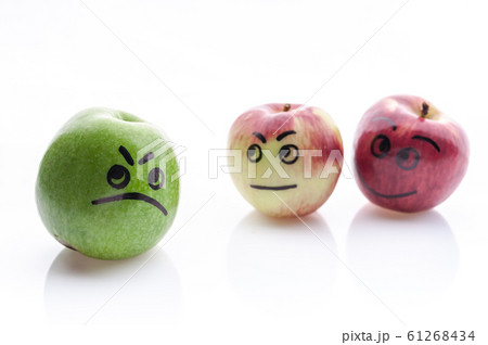 Face painted apples. Jolly and sad funny apples. 61268434