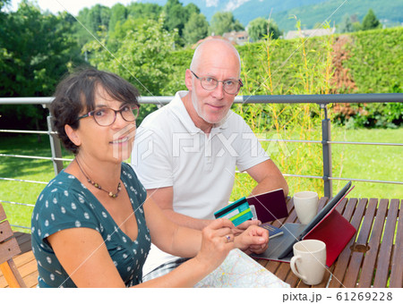 Senior couple preparing vacation trip Senior couple preparing vacation trip 61269228