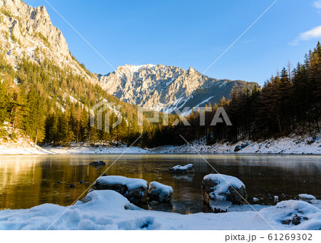 Peaceful mountain view with famous green lake in Austria Styria. Tourist destination lake Gruner See in winter. Peaceful mountain view with famous green lake in Austria Styria. Tourist destination lake Gruner See in winter. 61269302