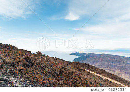 Fantastic view of the Spanish volcano Teide. Rocky volcanic view similar to the landscape of another planet - Mars Fantastic view of the Spanish volcano Teide. Rocky volcanic view similar to the landscape of another planet - Mars 61272534