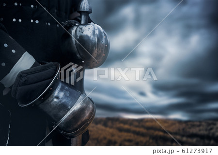 Crop of knight holding sword. Crop of knight holding sword. 61273917