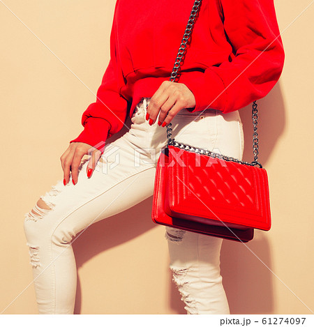 Fashion young woman in white jeans and sweater 61274097