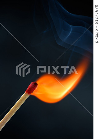 Wooden match stick with red head ignited and burning bright big fire flame with smoke Wooden match stick with red head ignited and burning bright big fire flame with smoke 61275670