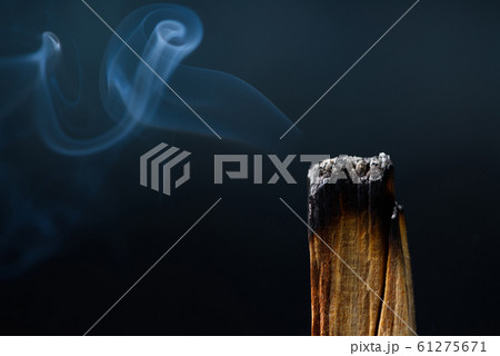 Palo Santo, holy sacred tree stick, macro close-up, burning with aromatic smoke. Palo Santo, holy sacred tree stick, macro close-up, burning with aromatic smoke. 61275671