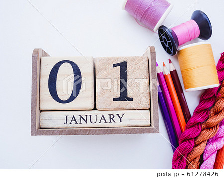 01 January wooden calendar new year day with Sewing equipment and smartphone on white background with blank space 01 January wooden calendar new year day with Sewing equipment and smartphone on white background with blank space 61278426