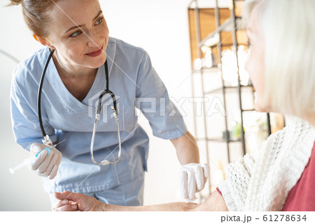 Portrait of pleased girl that treating her patient 61278634