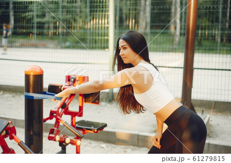 Beautiful couple training in a summer park Beautiful couple training in a summer park 61279815