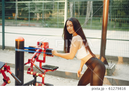 Beautiful couple training in a summer park Beautiful couple training in a summer park 61279816