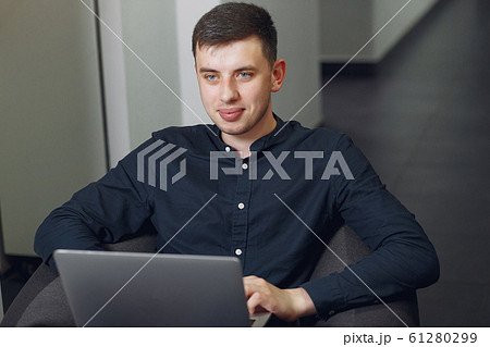 Stylish businessman working in a office and use the laptop 61280299