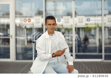 Handsome man standing near the airport 61280636